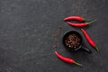 Chilli peppers on a black stone background Royalty Free Stock Photo