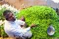 The chilli seller doing business in an Asian vegetables market