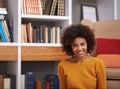 Chilling at home. Portrait of an attractive young woman smiling happily. Royalty Free Stock Photo