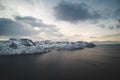 Chilling view from Mount Segla of the village of Fjordgard and the lake around it. Rocky mountains on the Senja peninsula in