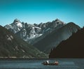 Chilliwack Lake mountain panorama with boat in the foreground and deep blue sky. Royalty Free Stock Photo