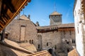 Chillon castle interior courtyard wide angle view with tower taken from wall walk in Switzerland Royalty Free Stock Photo