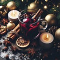 Glass of warm mulled wine with spices and Christmas decoration