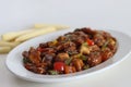 Chilly paneer with baby corn. An Indo Chinese dish made with cubes of paneer with baby corn, bell peppers, onions and a spicy Royalty Free Stock Photo