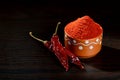 chilly powder in clay pot with red chilly Royalty Free Stock Photo