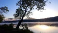 Chilly summer morning the fog overlaying the river