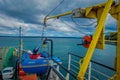 CHILOE, CHILE - SEPTEMBER, 27, 2018: Above view of cars inside of ferry and passengers for crossing from the Chilean Royalty Free Stock Photo