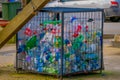 CHILOE, CHILE - SEPTEMBER, 27, 2018: Outdoor view of metallic box with some plastic botlles inside, recycling concept