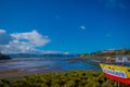 CHILOE, CHILE - SEPTEMBER, 27, 2018: View of beautiful colorful wooden restaurant cebiche on stilts palafitos, in a low Royalty Free Stock Photo