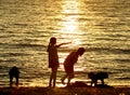 Chilren playing at sunset on beach