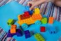 Chils playing with construction toy blocks building a tower in a sunny kindergarten room. Kids playing. creative games Royalty Free Stock Photo