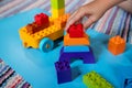 Chils playing with construction toy blocks building a tower in a sunny kindergarten room. Kids playing. creative games Royalty Free Stock Photo