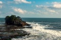 Chimeric temple on the water. Water temple in Bali. Indonesia nature landscape. Famous Bali landmark. Splashing waves