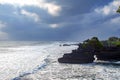 Chimeric temple on the water. Water temple in Bali. Indonesia nature landscape. Famous Bali landmark. Splashing waves