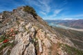 Chimgan mountains, Uzbekistan, amazing nature landscape with rocks, tulip flowers, lake and blue sky, travel background Royalty Free Stock Photo