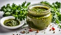 Chimichurri verde in a glass bowl on a white background