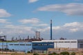 A chimney of ArcelorMittal formerly Ilva steel industry above the Tamburi Royalty Free Stock Photo