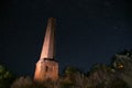 Chimney, brick oven, Ruins of the old castle in the city of Sataniv. Remains of the fortress, autumn night. Stars in the sky.