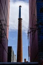 Chimney in the courtyard of the former ca Aranyo cotton factory, today headquarters of the Pompeu Fabra University of Barcelona Royalty Free Stock Photo