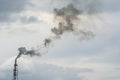 Chimney of a factory, blowing dirty smoke into the sky Royalty Free Stock Photo