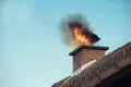 Chimney with a fire coming out Royalty Free Stock Photo