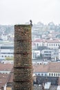 Chimney with funny figure in center of Trebic, Czech Royalty Free Stock Photo