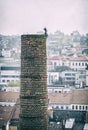 Chimney with funny figure in center of Trebic, Czech Royalty Free Stock Photo