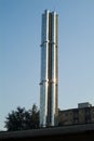 Chimney with group of pipes in polished steel