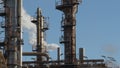 Chimney in a industrial factory expelling smoke a cloudy day