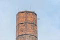 Chimney made of red bricks and blue sky Royalty Free Stock Photo
