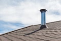 Chimney pipe from stainless steel on the roof of the house