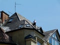 Chimney repair on high roof of classical old building Royalty Free Stock Photo