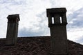 Chimney on roof with cloudy sky Royalty Free Stock Photo