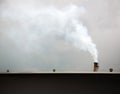 Chimney on the roof industry building was smoke coming out. Air Pollution and Greenhouse Effect Reduction concept. Royalty Free Stock Photo
