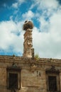 Chimney on the roof of an old building and a nest with storks at Trujillo