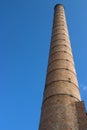 Chimney / smoke stack at abandoned factory site Royalty Free Stock Photo