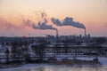 Chimney smoking stack on sunrise. Air pollution and climate change theme. Royalty Free Stock Photo