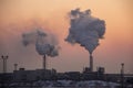 Chimney smoking stack on sunrise. Air pollution and climate change theme. Royalty Free Stock Photo