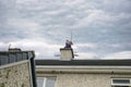 Chimney sweep busy cleaning chimney