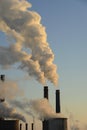 The chimney of a thermal power plant, the smoke extracted by a thermal power plant on the chimney, in the production process. Envi Royalty Free Stock Photo