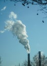 The chimney of a thermal power plant, the smoke extracted by a thermal power plant on the chimney, in the production process. Envi Royalty Free Stock Photo