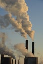 The chimney of a thermal power plant, the smoke extracted by a thermal power plant on the chimney, in the production process. Envi Royalty Free Stock Photo