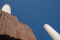 Chimneys at Battersea Power Station, renovated interwar building, now a mixed use retail and residential scheme.