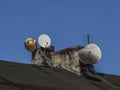 Chimneys and TV antennas in the old building Royalty Free Stock Photo