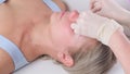 Chin massage of woman young woman during face massage at beauty salon