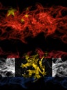 China, Chinese vs Benelux smoky mystic flags placed side by side. Thick colored silky abstract smoke flags