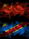 China, Chinese vs Democratic Republic of the Congo smoky mystic flags placed side by side. Thick colored silky abstract smoke