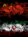 China, Chinese vs Iran, Iranian smoky mystic flags placed side by side. Thick colored silky abstract smoke flags