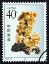 CHINA - CIRCA 1992: A stamp printed in China from the `Qingtian Stone Carvings` issue shows Harvest Zhang Aiting, circa 1992.