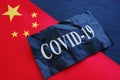 China flag and covid 19 coronavirus sign as symbol of chinese flu